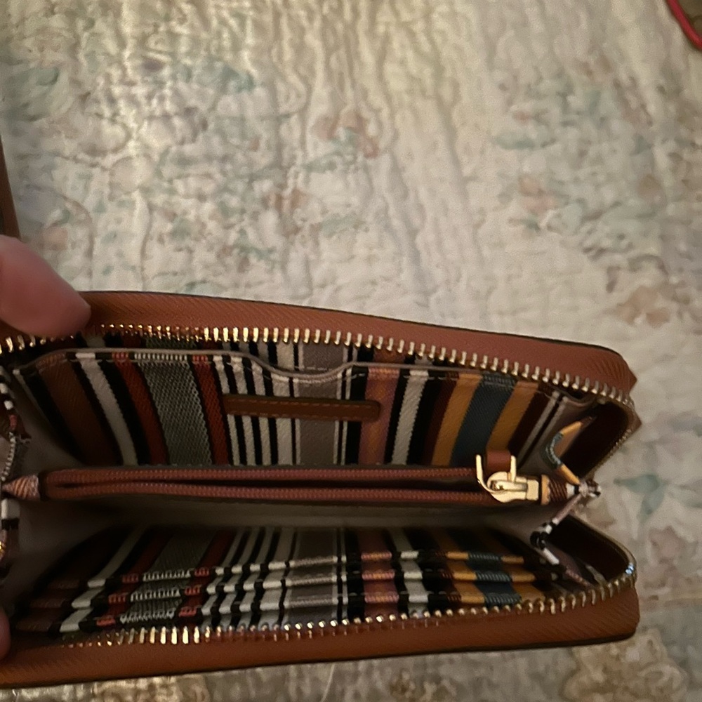 Tory Birch striped wristlet.